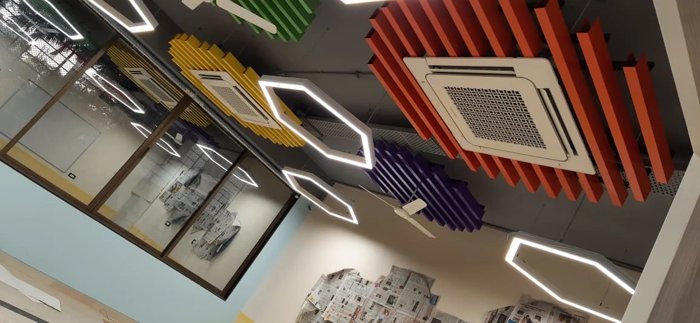 Ceiling cassette AC units installed in a modern interior